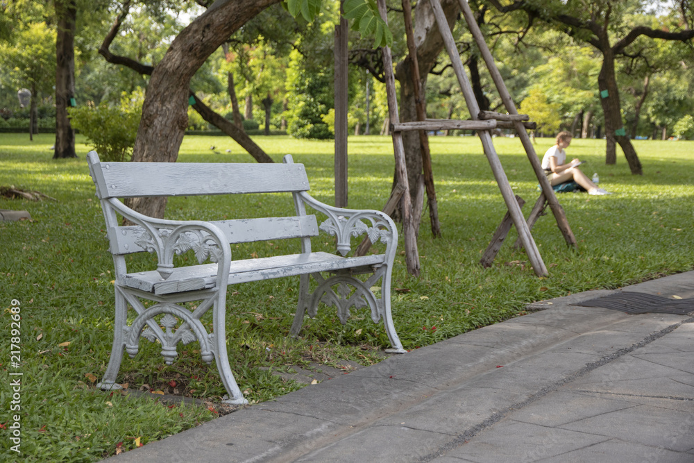 Gray metal bench in the park.