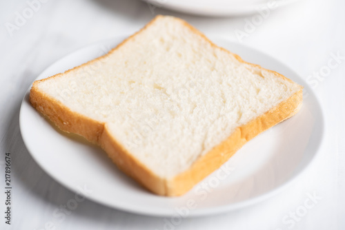 Sliced bread on white plate