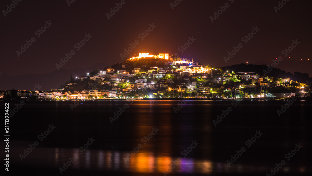 Night scene of Astros town with old castle Greece