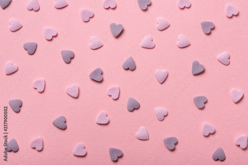 beautiful sweet pink sprinkles of heart shapes over pink background, concept of St. Valentines Day beautiful sweet pink sprinkles of heart shapes over pink background, concept of St. Valentines Day