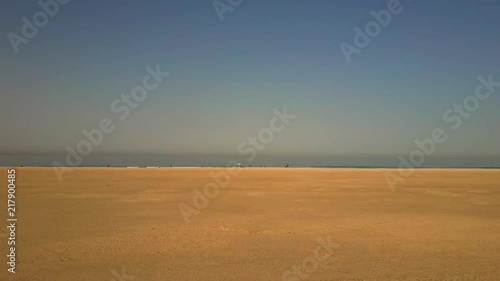 4K Aerial View From Flying Drone Of People At The Beach In Gibraltar