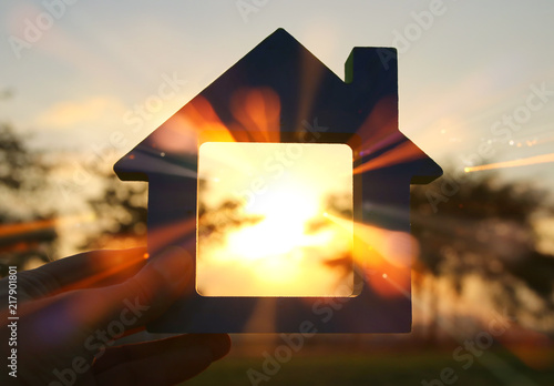 Image of vintage house in the grass, garden or park at sunset light. photo