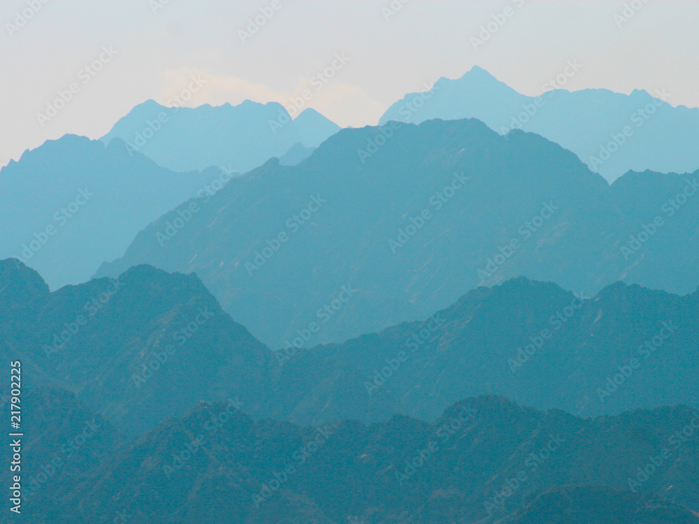 Layers of mountain ridges receding into the distance.