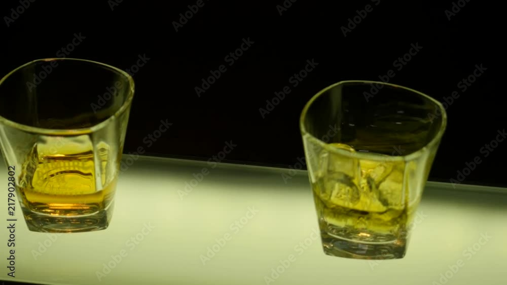 Pan up closeup shot of whiskey glasses Pan up closeup shot of whiskey glasses