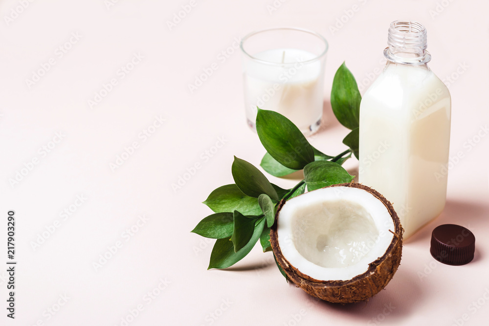 Coconut oil and tropical leaves. Hair care spa concept. Toned Coconut oil and tropical leaves. Hair care spa concept. Toned