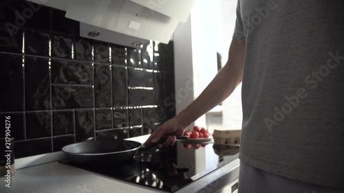 Kitchen. Man Pouring Oil On Frying Pan For Cooking  Breakfast