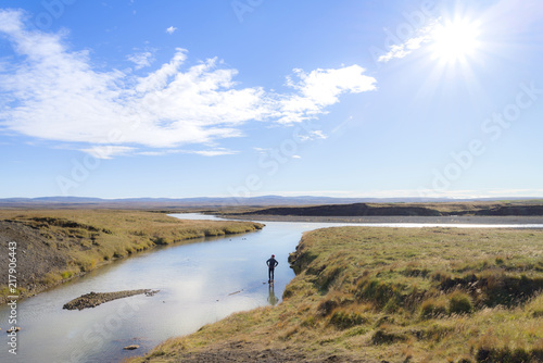 Fototapeta Naklejka Na Ścianę i Meble -  A man tourist enjoy the view of The river Olfusa near Gullfossfall , Iceland
