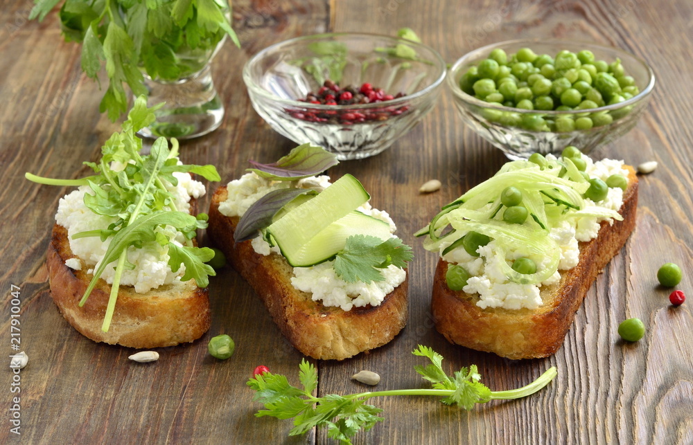 Crostini with cream cheese, green vegetables and herbs Crostini with cream cheese, green vegetables and herbs