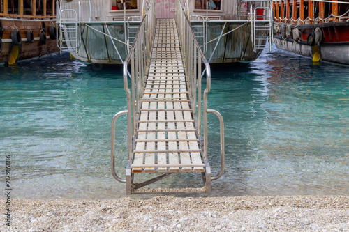 Принти на полотні Ship gangway on the sandy beach