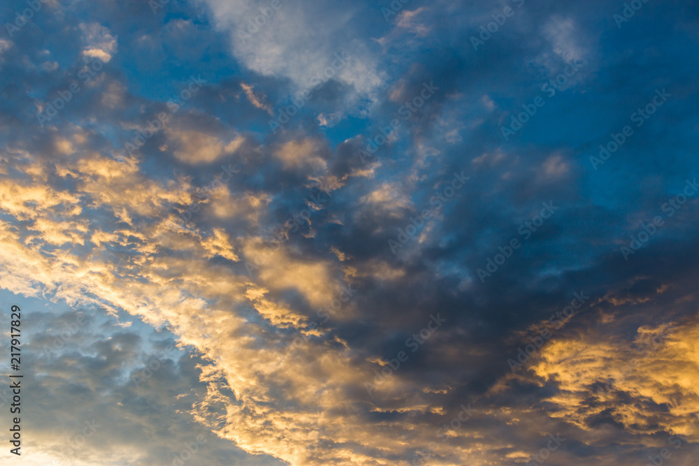 Dramatic sunset cloud with blue and gold color Dramatic sunset cloud with blue and gold color