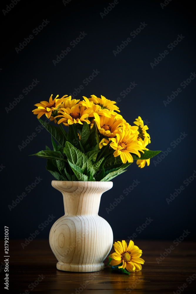 bouquet of yellow big daisies on a black bouquet of yellow big daisies on a black