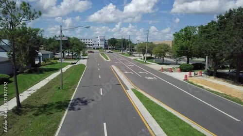 Wallpaper Mural 4K low altitude aerial drone footage panning from right to left across 4 lane road and sidewalk with landscaping, Torontodigital.ca