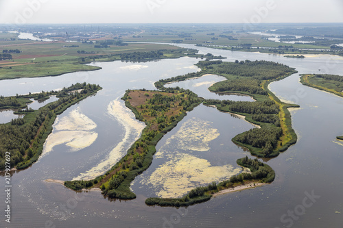 Aerial view estuary Dutch river IJssel with small islands and wetlands in lake Ketelmeer photo