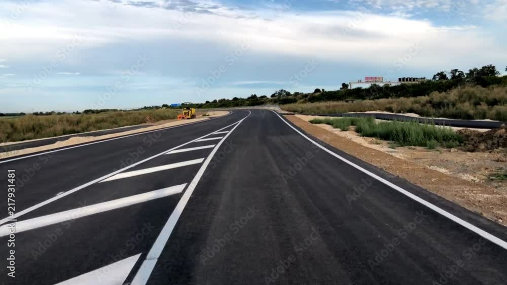 bicycle riding on a freshly paved and marked road bicycle riding on a freshly paved and marked road