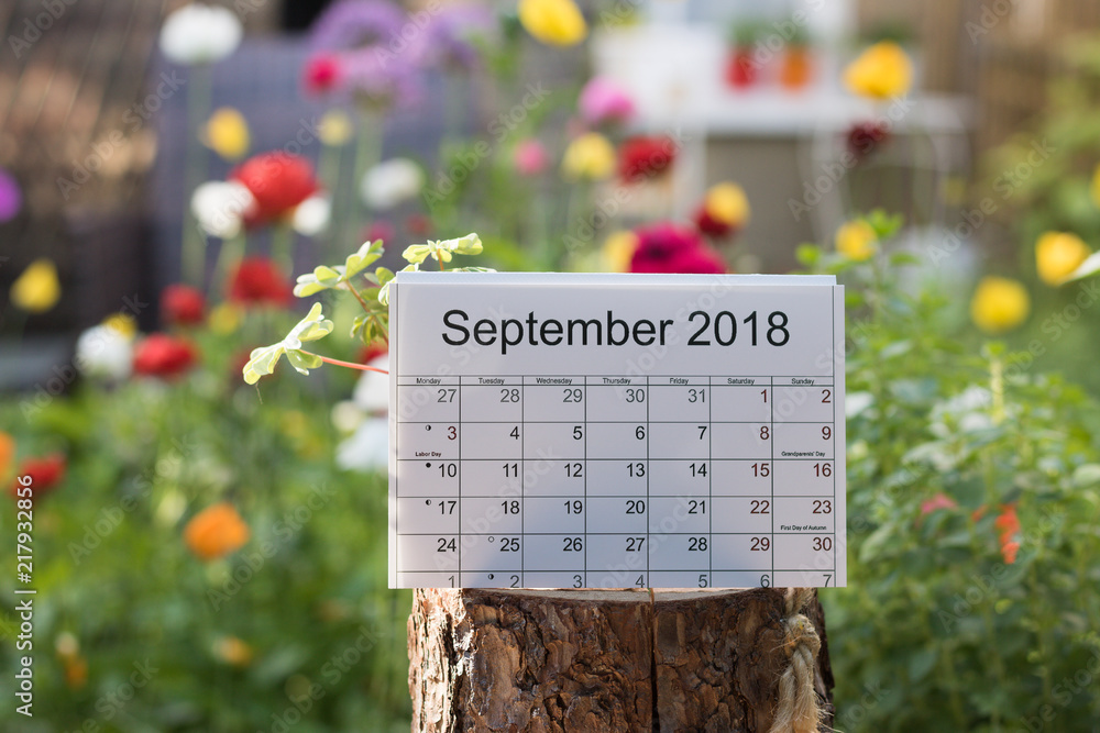 Calendar September 2018 - a full month with holidays and lunar days for  gardening. A blurred background