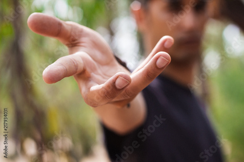 young man hand pointing to camera - provides hand - offering his support to you