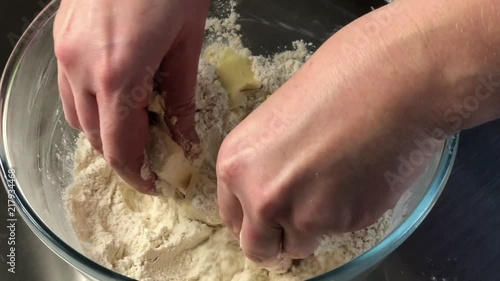 Mixing butter into floud for baking pastry photo