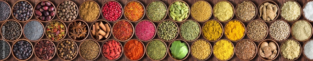 Colorful Indian spices background, top view.  large set of seasoning is lined with a rainbow - obrazy, fototapety, plakaty 