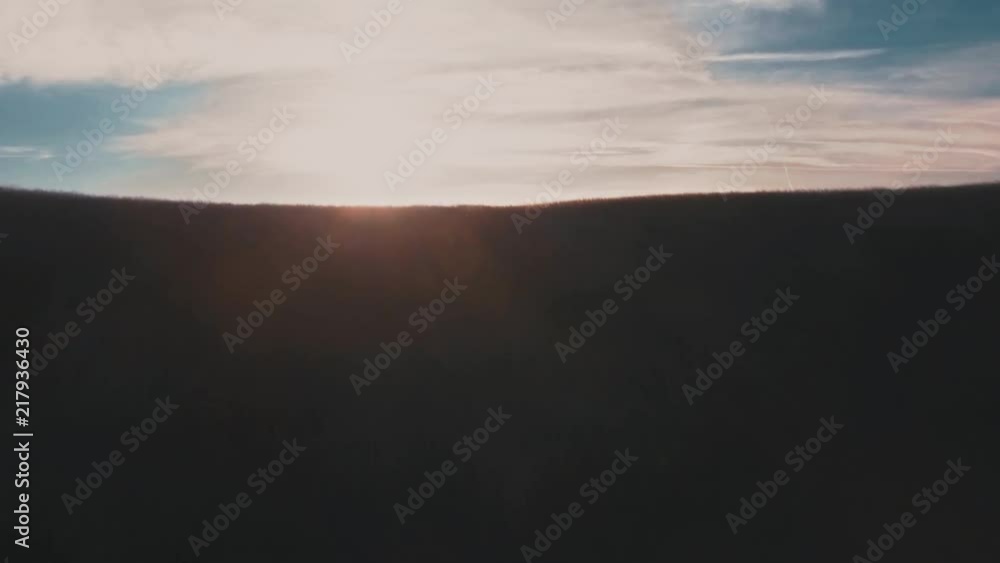 Graded version of a dramatic drone shot showing revealing a hilly landscape. Graded version of a dramatic drone shot showing revealing a hilly landscape.