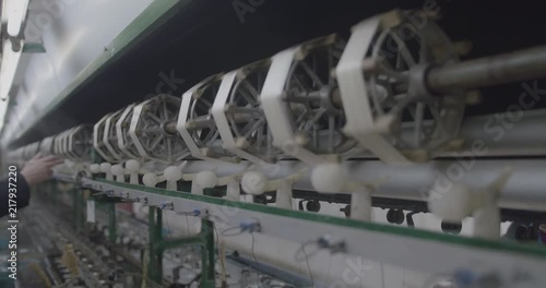 Machine reeling in silk from cocoon.