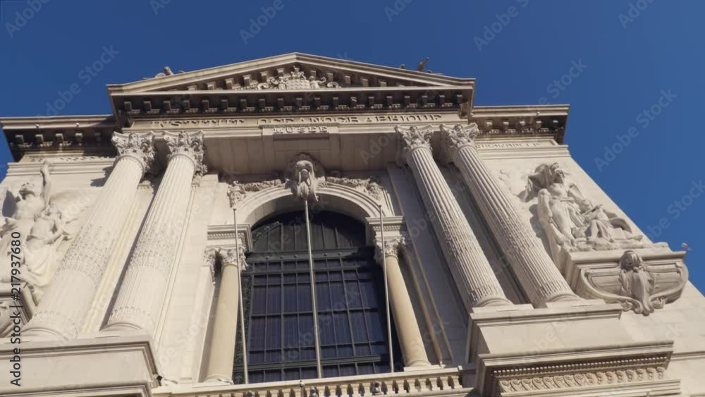 Bottom-up view to famous Oceanographic Museum against blue sky, camera softly moving in front of the facade of the building. Bottom-up view to famous Oceanographic Museum against blue sky, camera softly moving in front of the facade of the building.