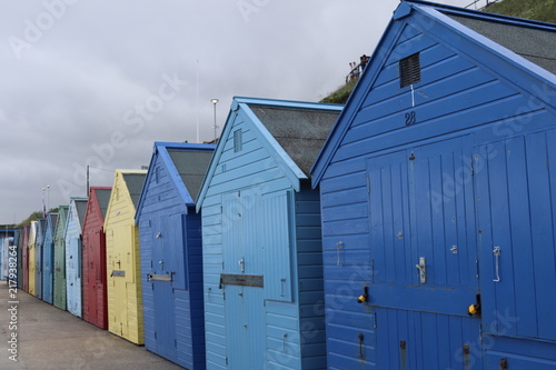 colourful beach huts on mundesley beach front