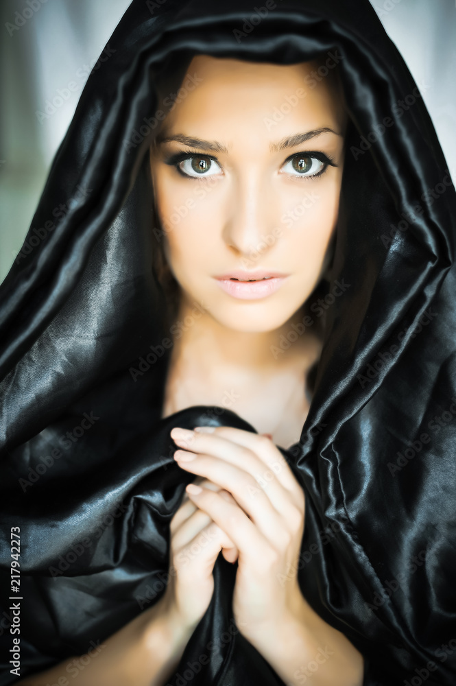 Naklejka premium Beautiful young woman in prayer, nun