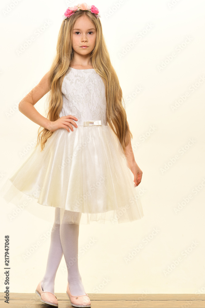 small princess. small princess in beautiful dress. small princess isolated on white. small princess with long wavy hair. cool girl.