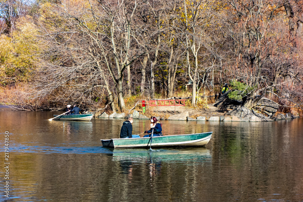 Obraz premium Boating in Central Park during the fall autumn season. Rented Boats on Lake (south of the Great Lawn). New York. NY, USA,