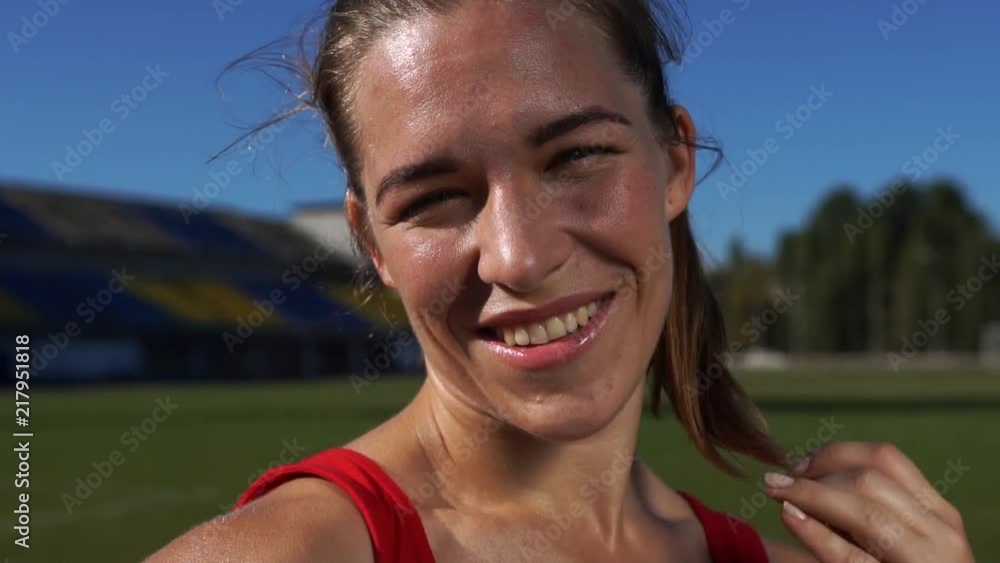 Portrait of Beautiful Charming Sports Woman on the Background of Summer Sunny Day Portrait of Beautiful Charming Sports Woman on the Background of Summer Sunny Day