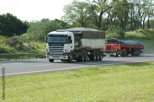 no brand new white truck and no brand old orange truck burning diesel loaded