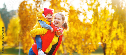 happy family mother and baby son on autumn walk