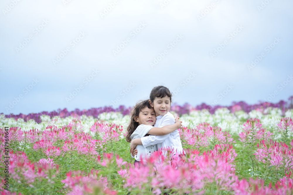 Two girls hugging happily Two girls hugging happily