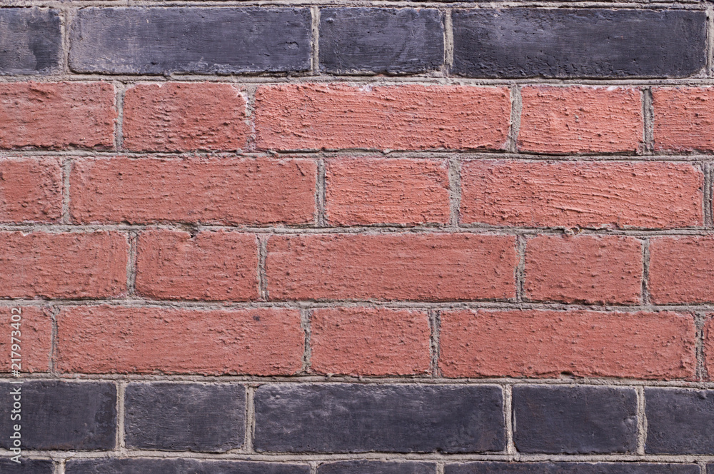 Obraz premium brick wall painted black and orange background. texture, architecture.
