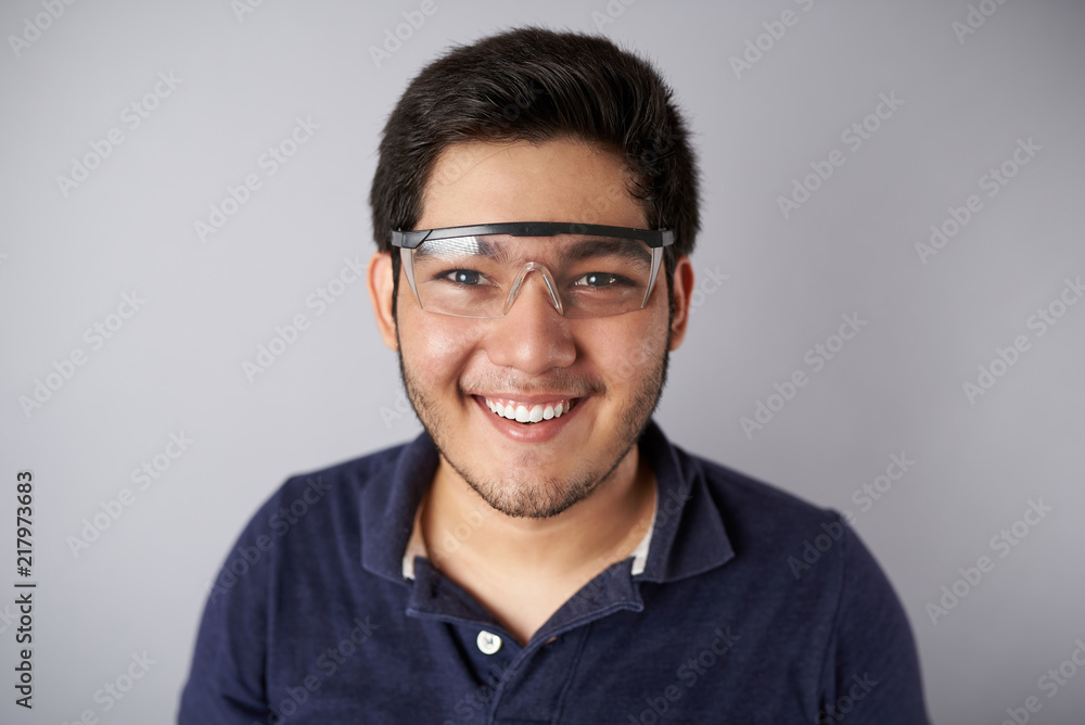 Smiling young man in protective gear Smiling young man in protective gear