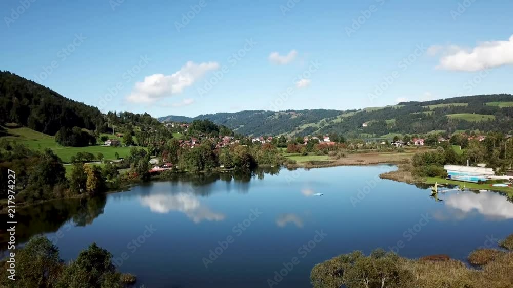 AERIAL: Flight over a small Lake and City next to a bigger Lage AERIAL: Flight over a small Lake and City next to a bigger Lage
