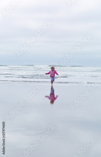 Small, Cute, 2 years Girl, Blonde hair, playing in the water, running, Pacific Ocean, Oregon coast, family vacation time, reflection in the water