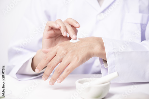 doctor applying hand cream