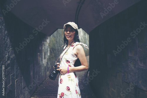 Young girl traveler sitting...