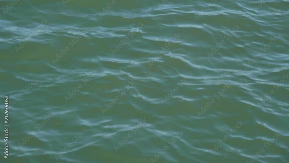 A close up slow motion view of the beautiful turquoise waters surrounding the Magdalen Islands, a popular tourist and vacation destination in Quebec.