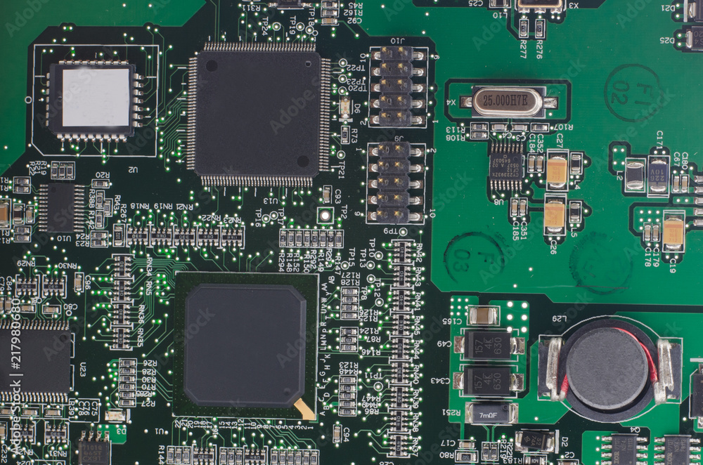 Detail of an electronic printed circuit board with many electrical components Detail of an electronic printed circuit board with many electrical components