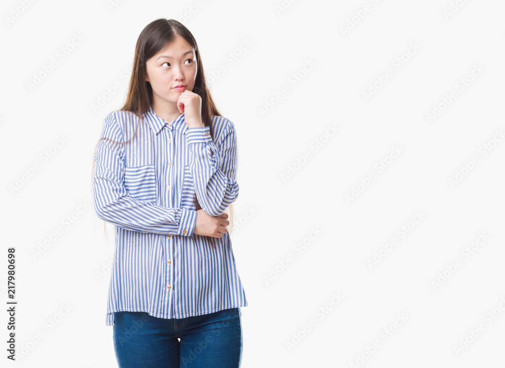 Young Chinese woman over isolated background with hand on chin thinking about question, pensive expression. Smiling with thoughtful face. Doubt concept. Young Chinese woman over isolated background with hand on chin thinking about question, pensive expression. Smiling with thoughtful face. Doubt concept.