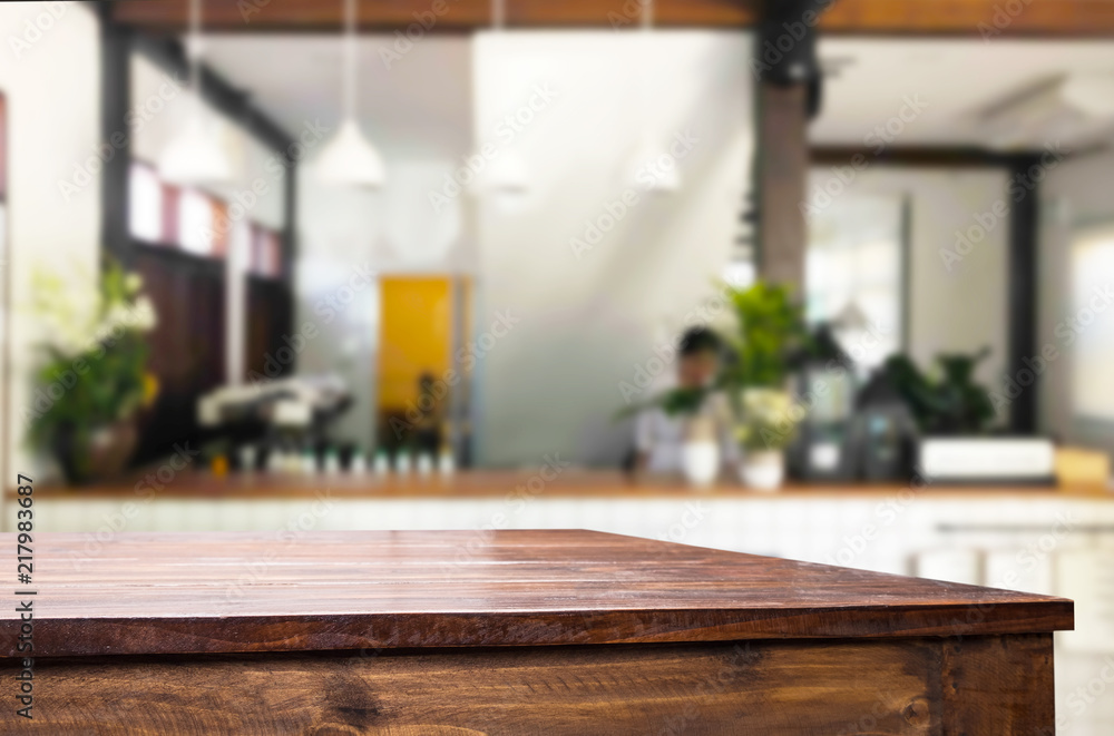 Selected focus empty brown wooden table and Coffee shop or restaurant blur background with bokeh image. for your photomontage or product display Selected focus empty brown wooden table and Coffee shop or restaurant blur background with bokeh image. for your photomontage or product display