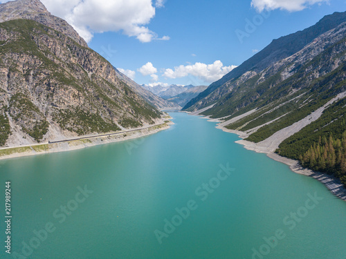 Fototapeta Naklejka Na Ścianę i Meble -  Drone aerial view of the Lake Livigno an alpine artificial lake. Italian Alps. Italy