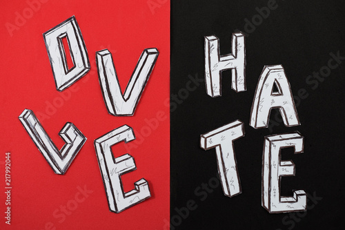 written word love  on a red background and hate on a black background
