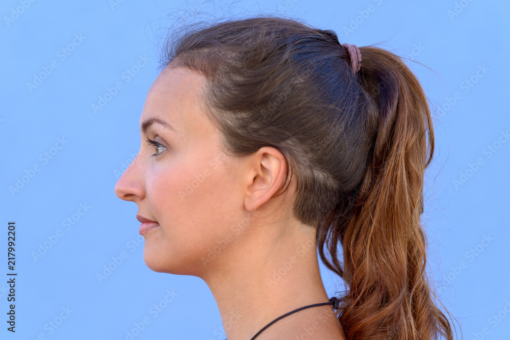 Side portrait of pretty young brunette woman Side portrait of pretty young brunette woman