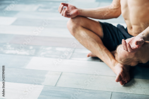 sport fitness and stamina training. physical exercising for strong body and healthy mind. yogi in a lotus pose relaxing and meditating.