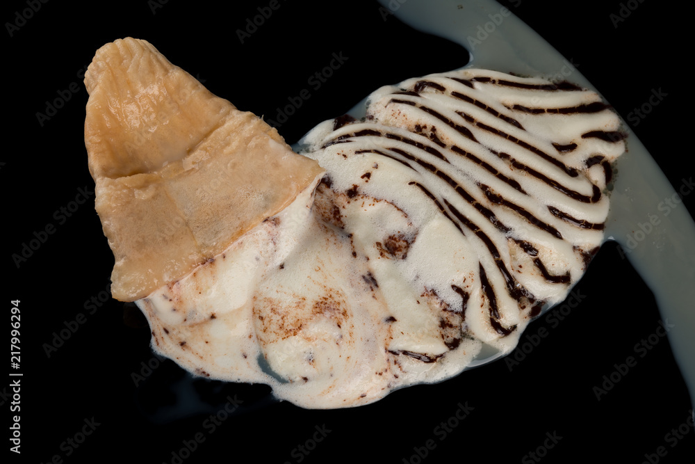top view ice cream cone melting completely on black background top view ice cream cone melting completely on black background
