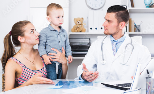 Adult male doctor leading medical appointment