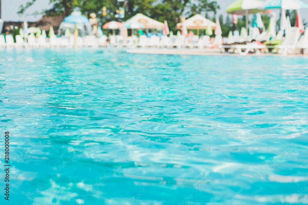 Water swimming pool. pool with blue water. Background of clean blue rippled water in a hotel swimming pool